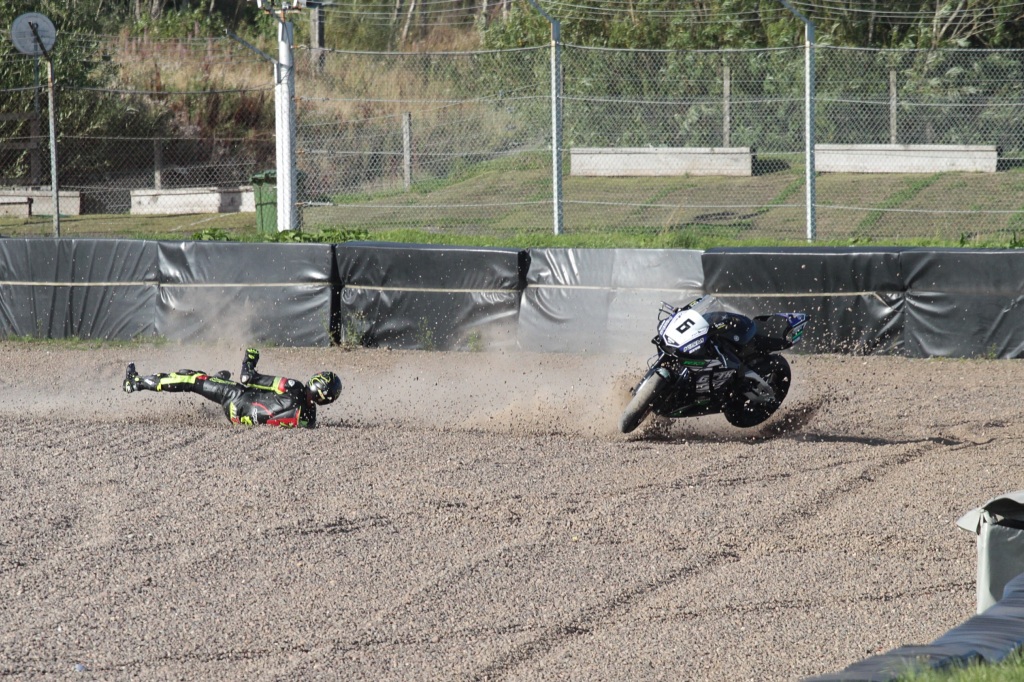 Steven Allison slides into the gravel with his Yamaha motorcycle